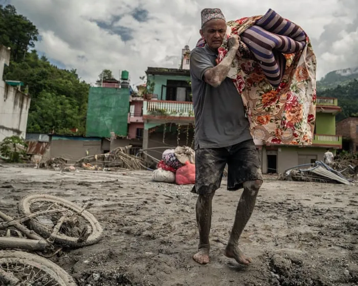 Devastated by floods and overwhelmed by bodies, Nepalis weep for what remains of their homes
