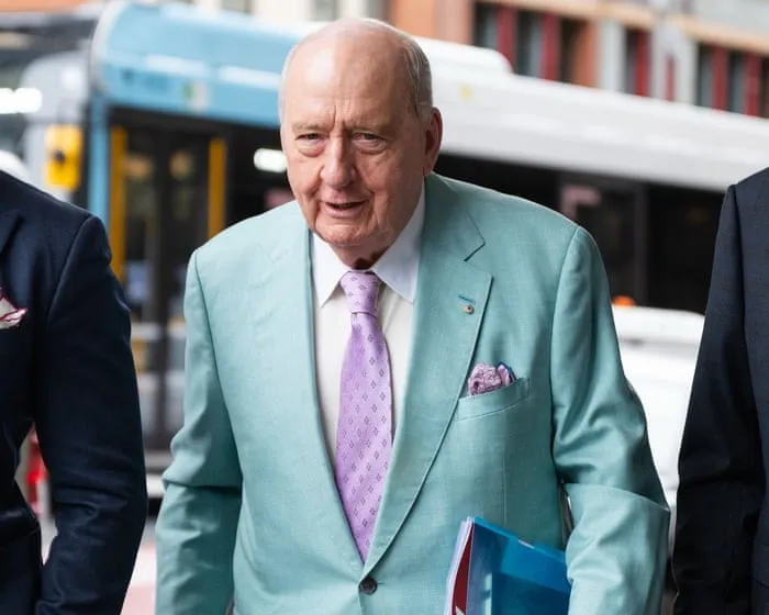 Alan Jones welcomed prominent athlete to luxury home with ‘hug and slap on the bottom’, former butler tells court