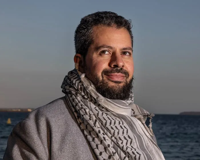 Palestinian careers adviser who was allegedly told to stop wearing keffiyeh at NSW school sues state for racial discrimination