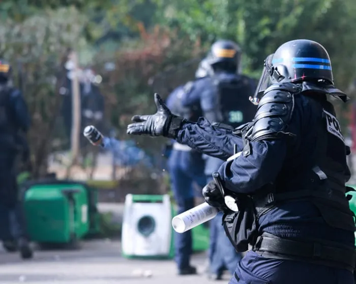 French police suspend use of stun grenades after high school protester loses hand