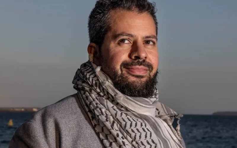 Palestinian careers adviser who was allegedly told to stop wearing keffiyeh at NSW school sues state for racial discrimination