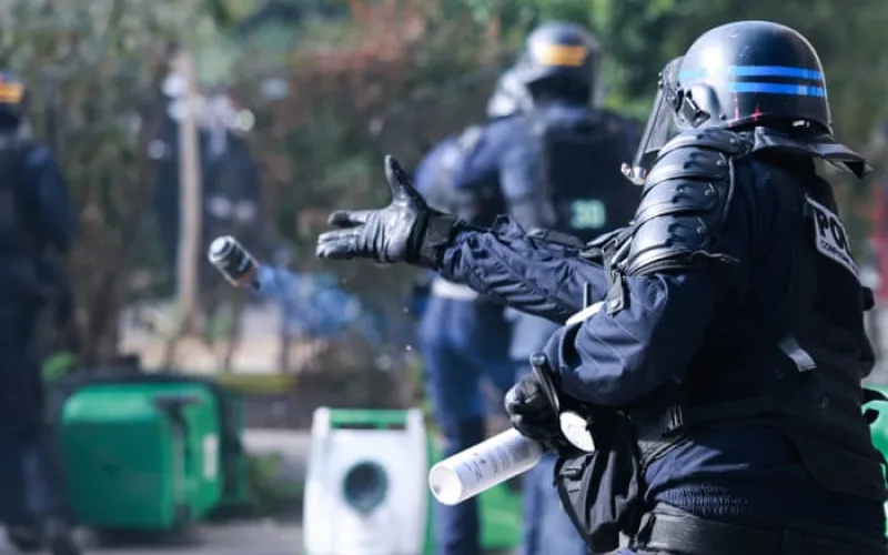 French police suspend use of stun grenades after high school protester loses hand